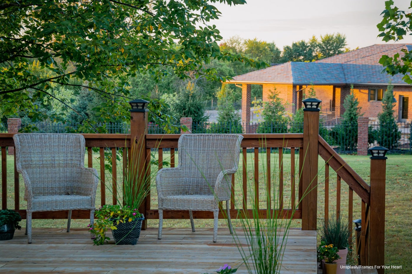 patio with two chairs and pot flowers