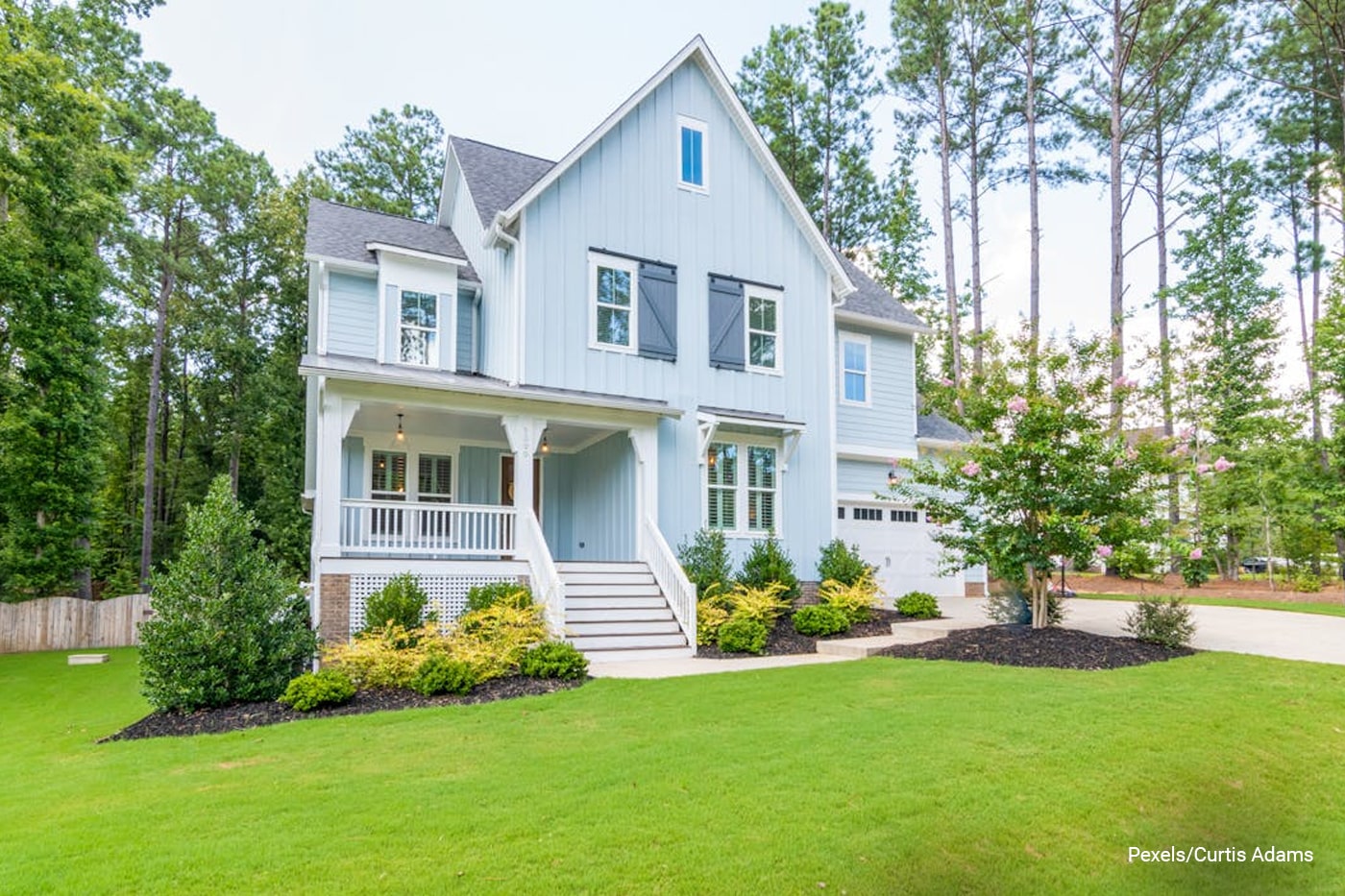 house surrounded by lawns and flowers