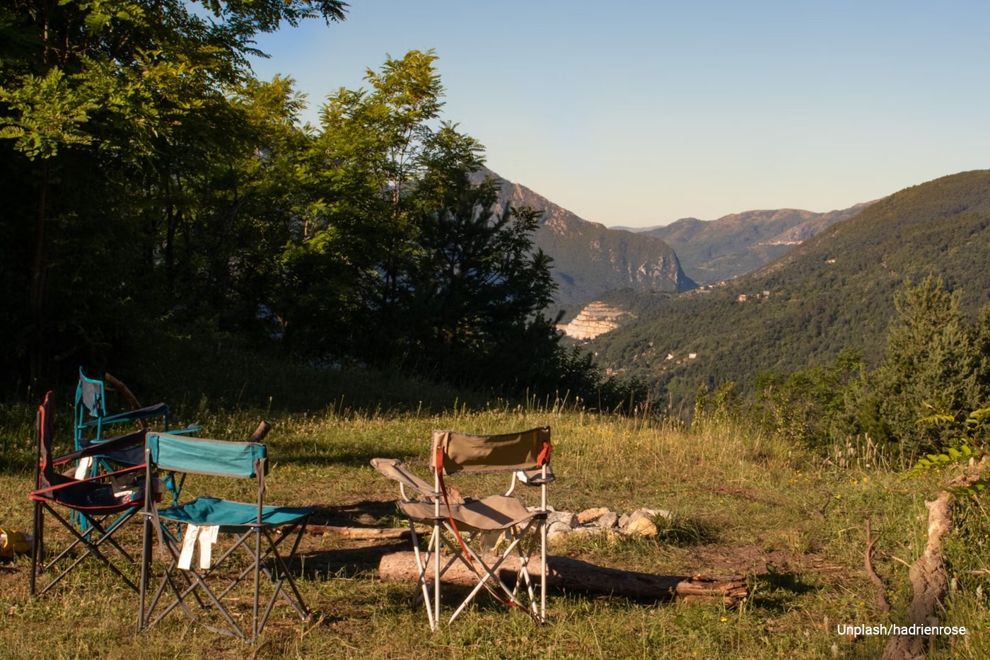 three camping chair facing mountains
