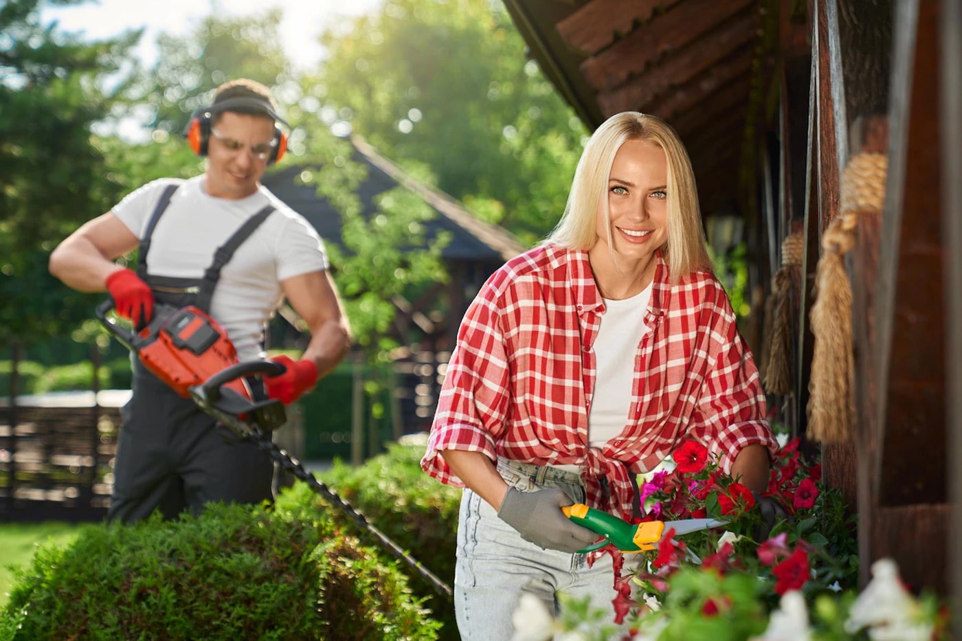 man and woman using pruning tools