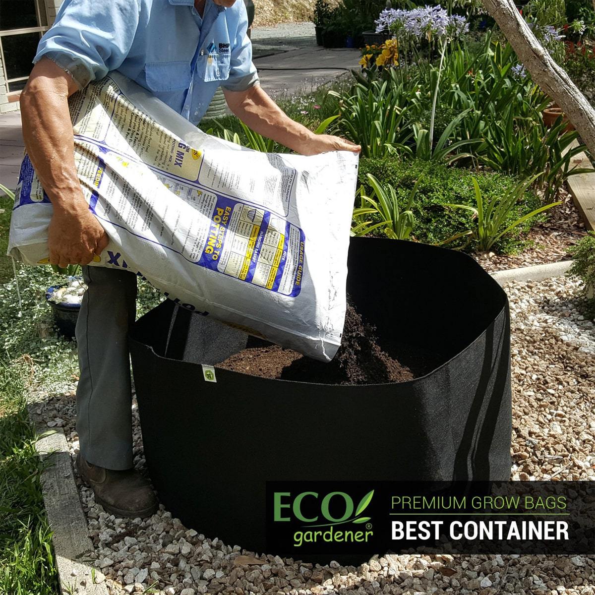 Man putting soil in ecogardener grow bags