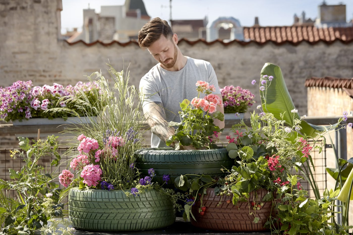 man arranging flower garden