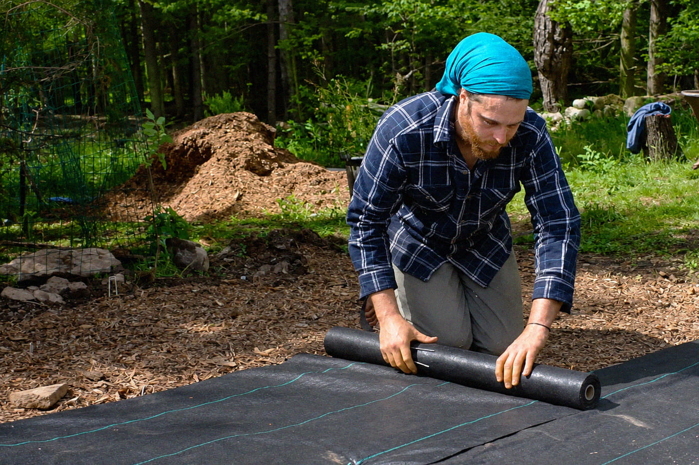 man unrolling the fabric