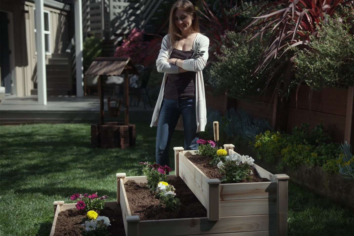woman using ecogardener tiered bed plants