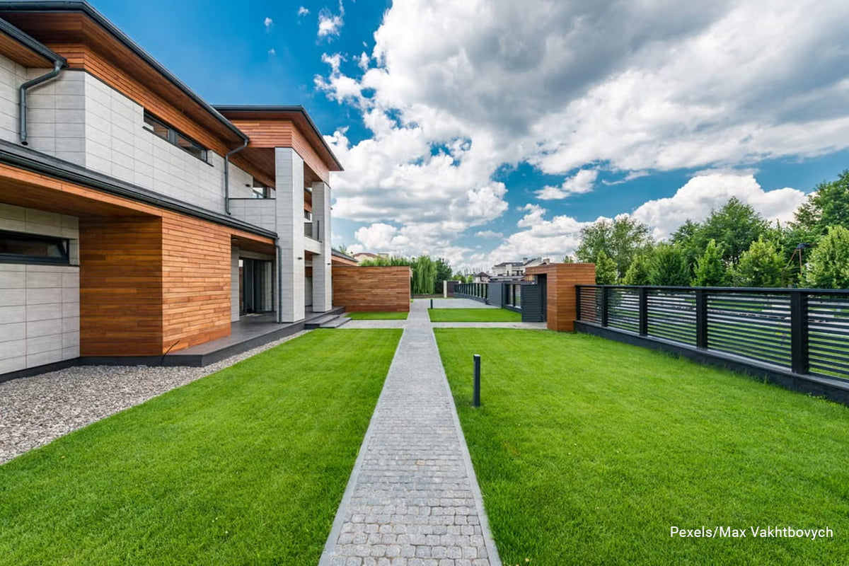 A modern house exterior with contemporary design with lush green lawn