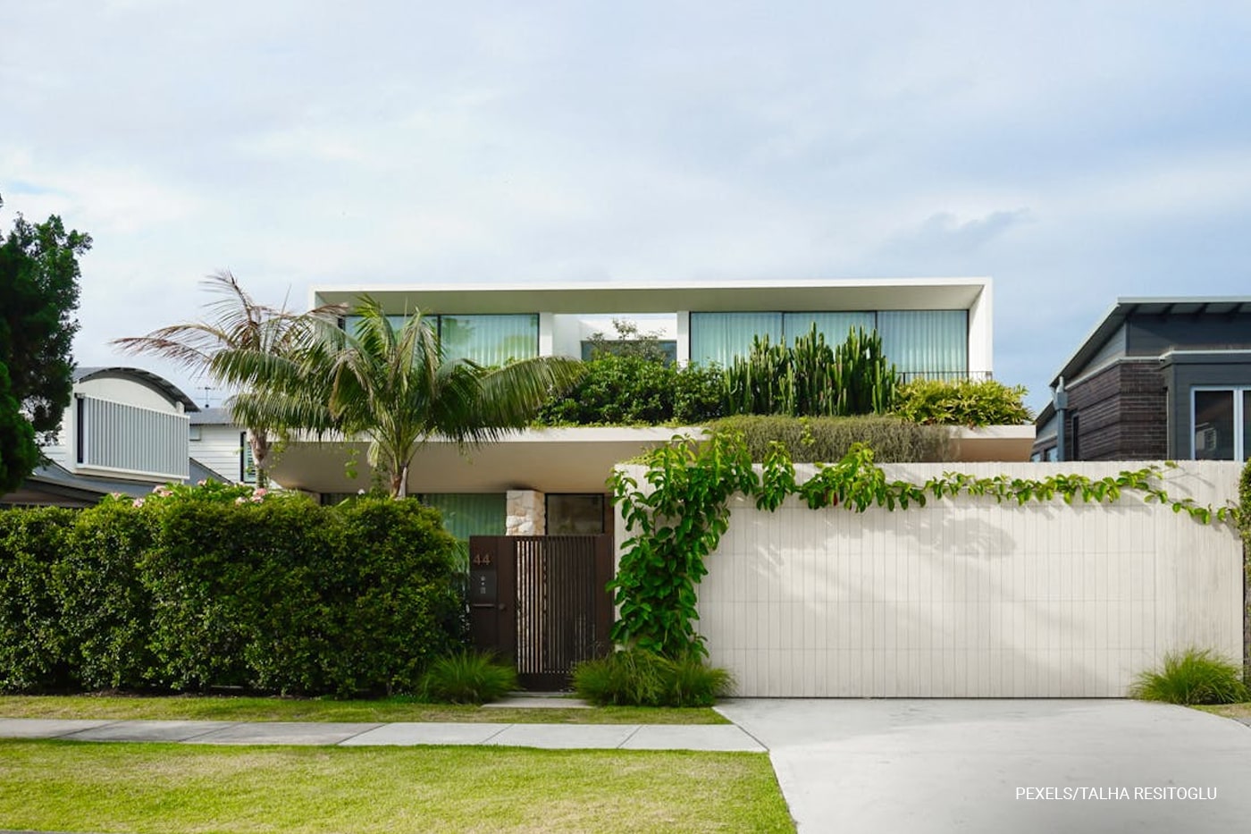 white house with modern landscape