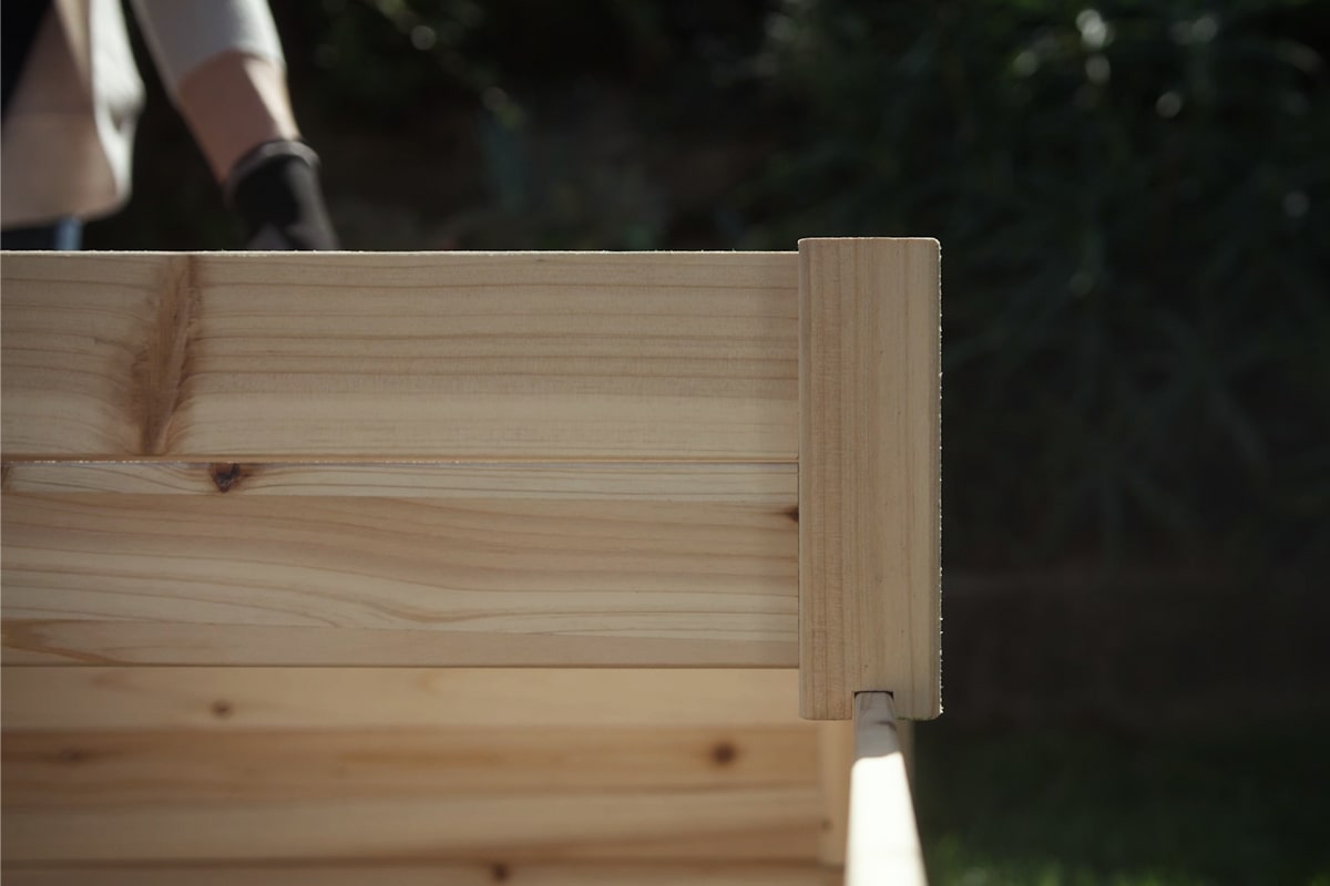 A raised bed garden being assembled