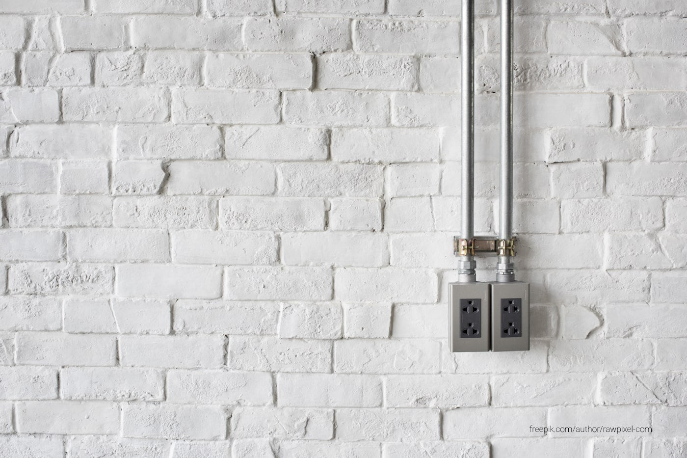 Electrical Socket in a White Painted Wall