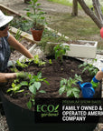 Mother and daughter planting plants in ecogardener grow bags