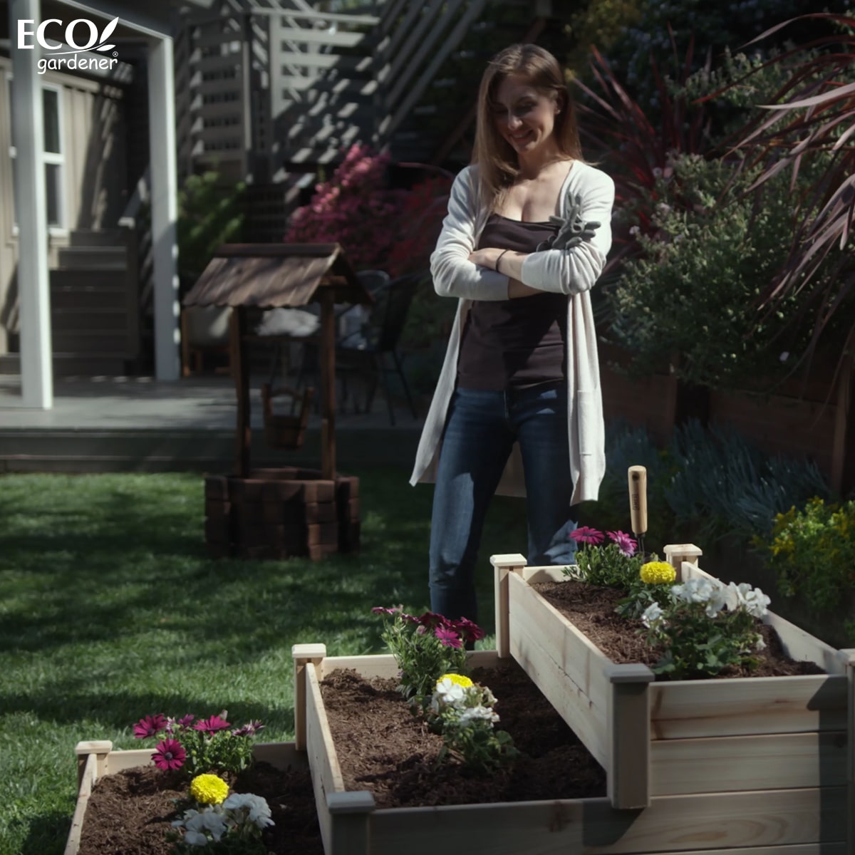 A woman looking at Ecogardener Tiered Raised Bed